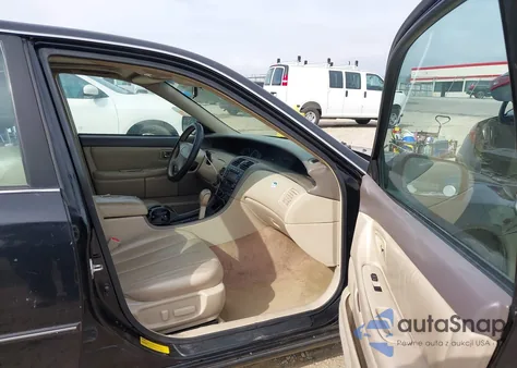 2000 Toyota Avalon Xl z USA, uszkodzony, nr VIN 4T1BF28B4YU113121